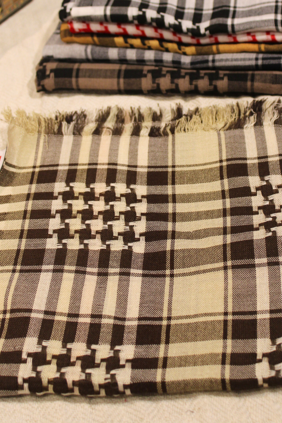 Lifestyle shot featuring the beige Kuffiyeh, showcasing its versatility and comfort for everyday wear.