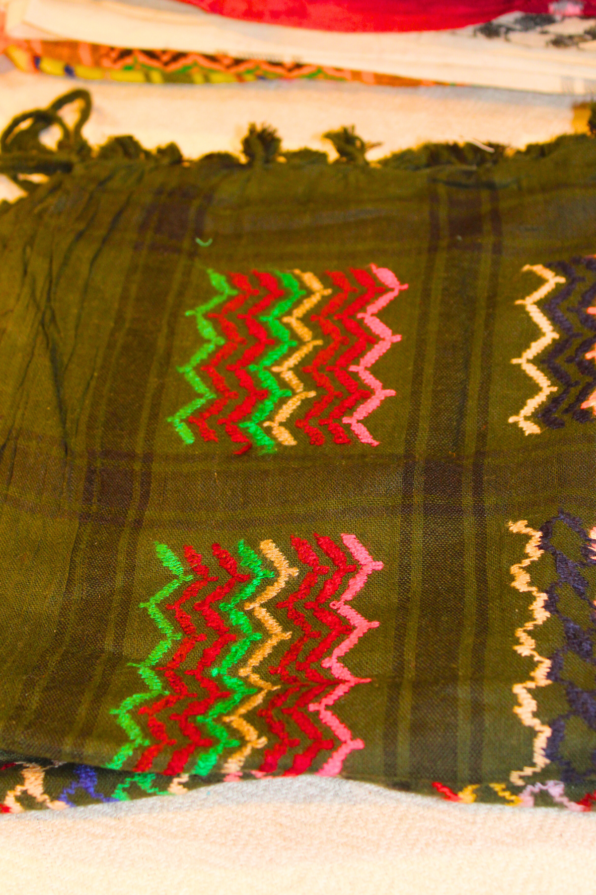 Handcrafted Dark Green Keffiyeh scarf from Soumak Boutique, showcasing premium cotton craftsmanship and vibrant cultural patterns.