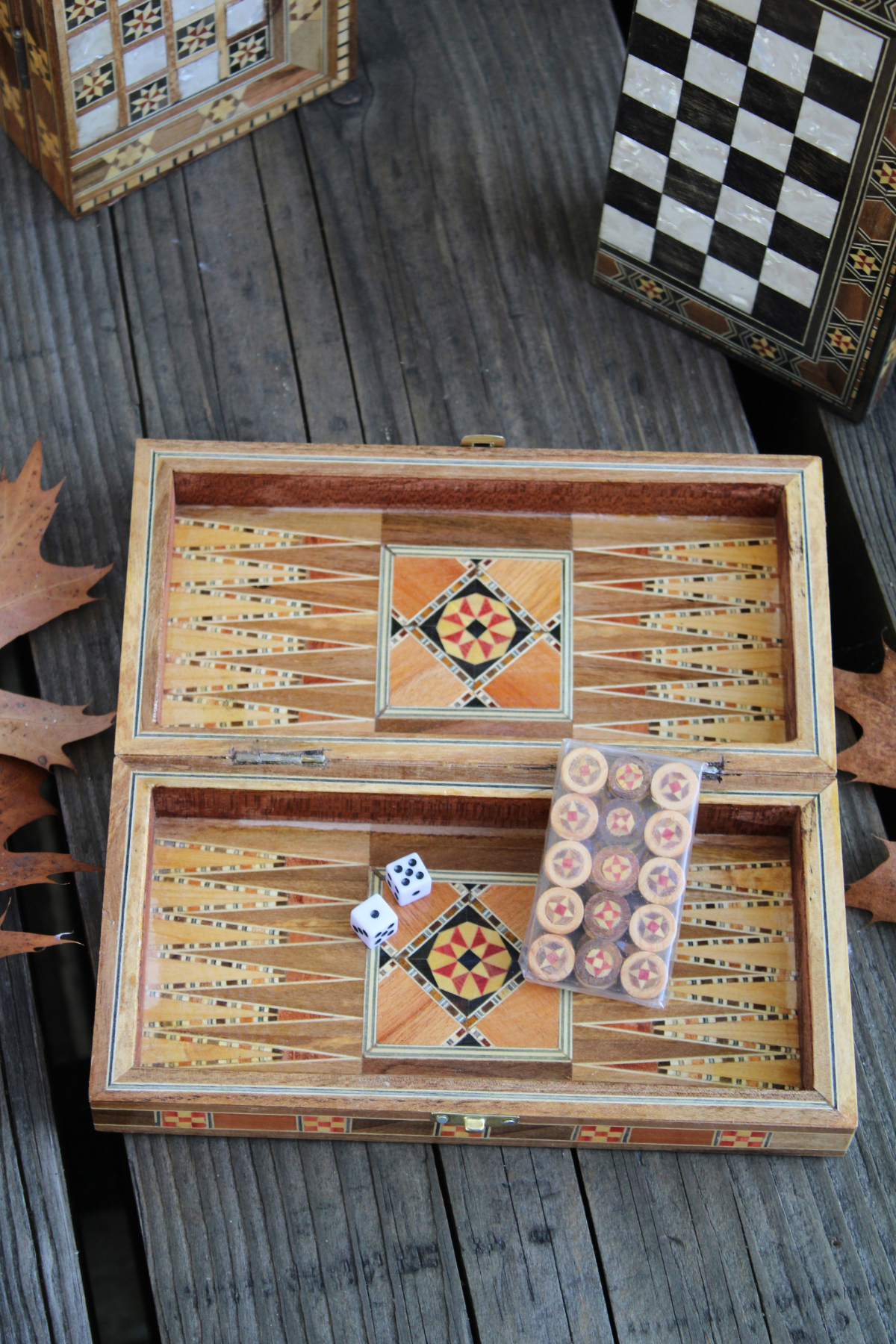 Dive into a backgammon game with our Mini Syrian Handcrafted Mosaic Chess/Backgammon Board, showcasing the intricate mosaic design with vibrant backgammon pieces.