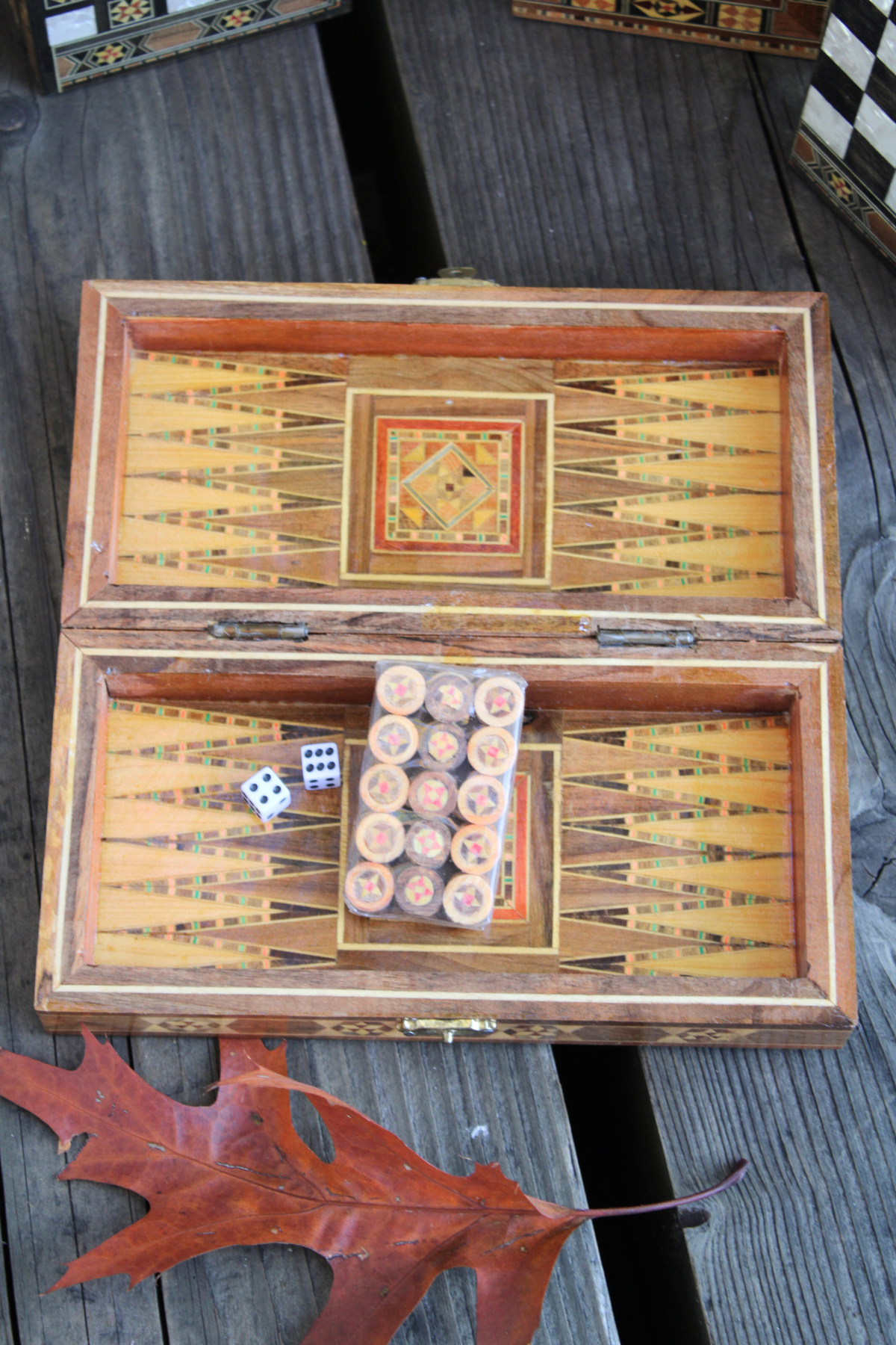 Dive into a backgammon game with our Mini Syrian Handcrafted Mosaic Chess/Backgammon Board, showcasing the intricate Sparkling Blossom design with vibrant backgammon pieces.