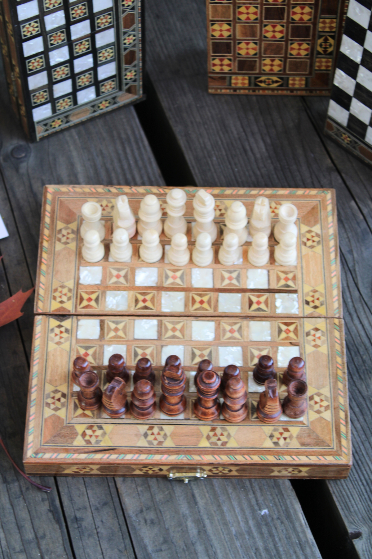 Enjoy a game with our Mini Syrian Handcrafted Mosaic Chess/Backgammon Board, featuring the Sparkling Blossom motif alongside beautifully crafted chess pieces.