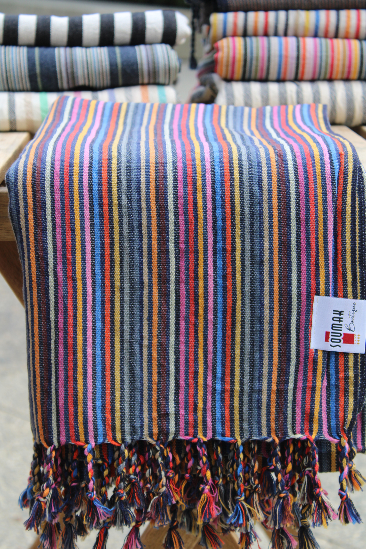 Striped colorful Turkish Towel with tasels and soumak boutique logo