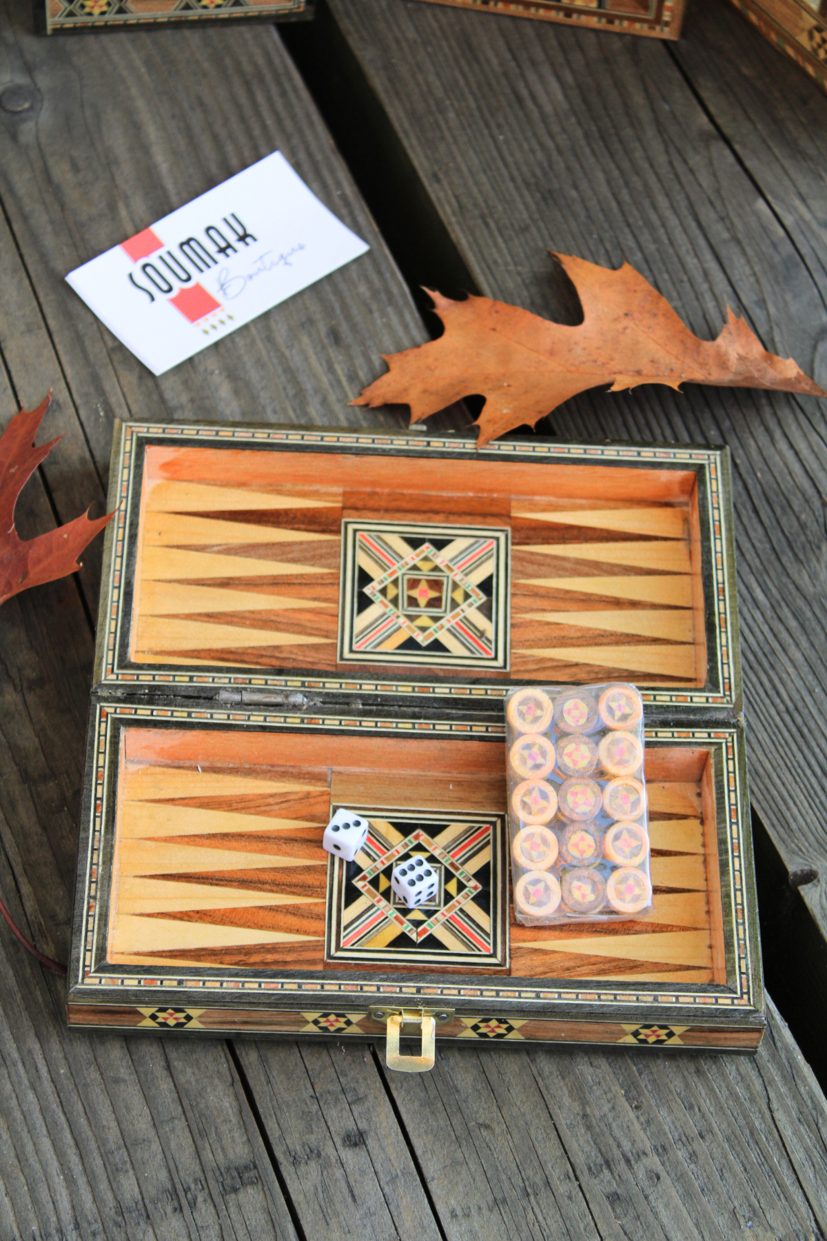 Backgammon side of the Mini Syrian Board, complete with wooden checkers and dice, showcasing its elegant design and functionality.